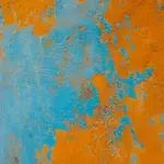 mur bleu et orange avec des craquelures